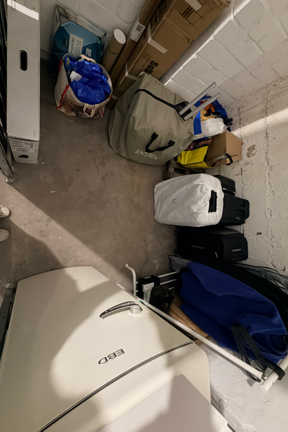 Decluttered storage room with a simple home organizing system in Berlin