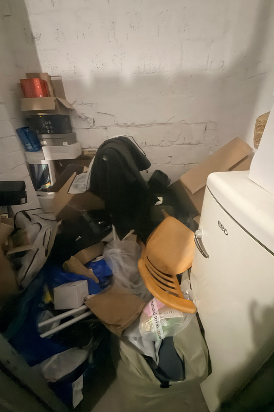 Cluttered storage room before a home organizing session in Berlin